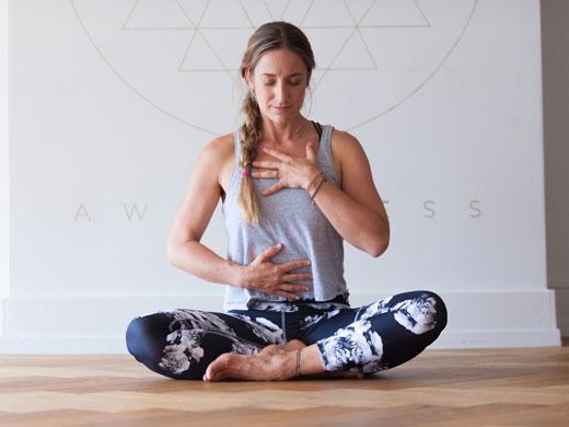 woman sitting in erect yoga pose