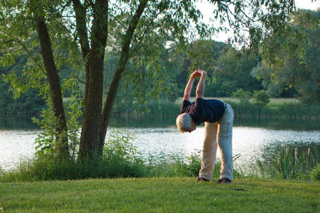 older man bending over at his waist